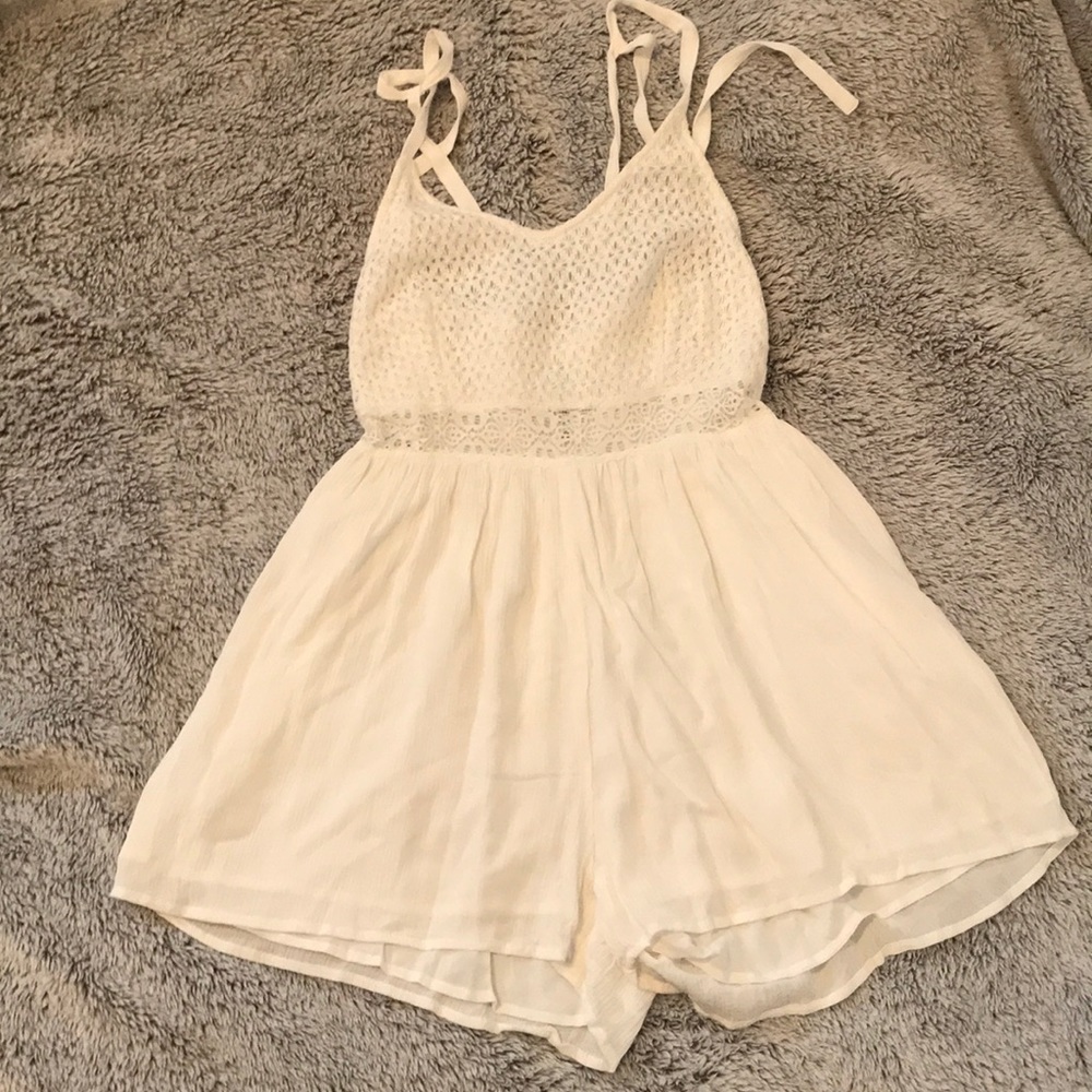 White Romper with neck tie halter.